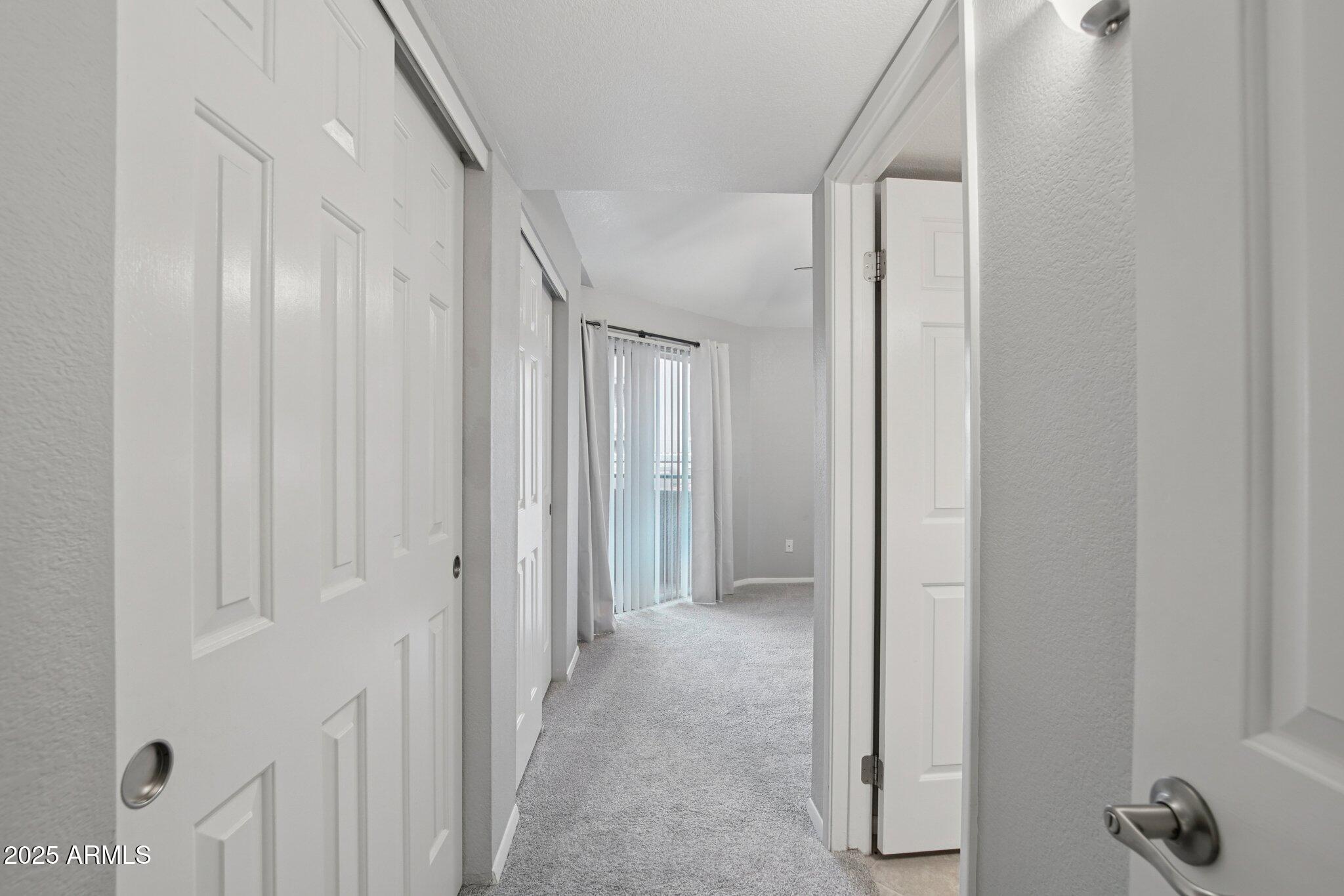 1720 East Thunderbird Road, Unit 2024 Phoenix, AZ 85022 - Photo 10 of 23 a view of a hallway with closet area