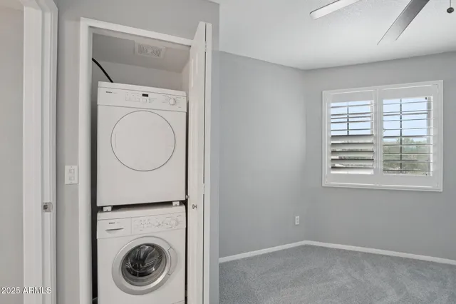 a bathroom with a sink a toilet a mirror and shower