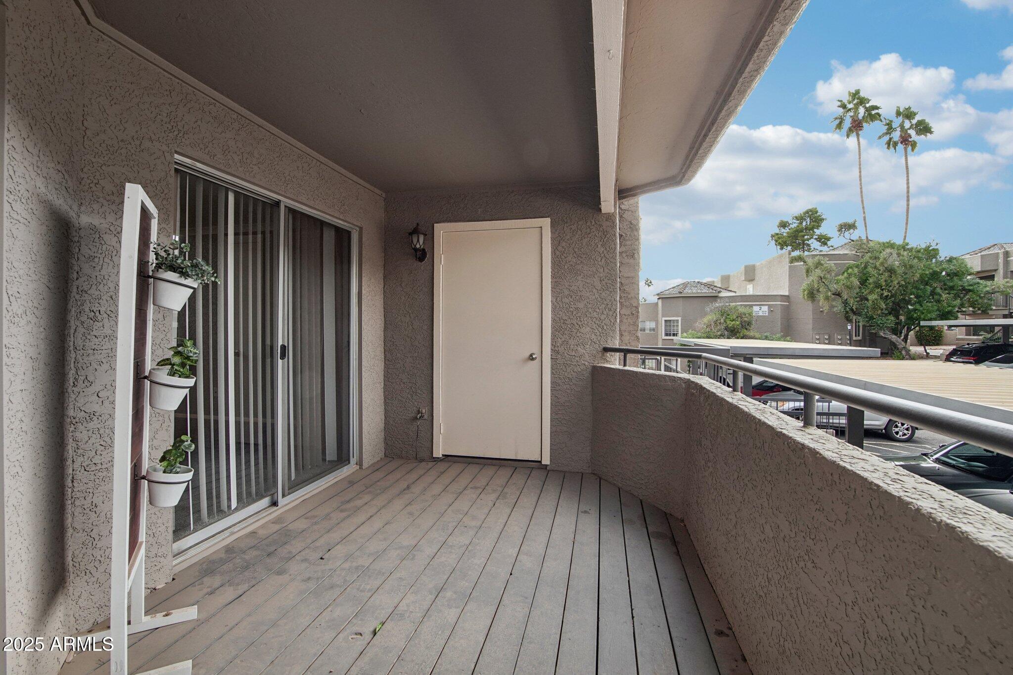 1720 East Thunderbird Road, Unit 2024 Phoenix, AZ 85022 - Photo 17 of 23 a view of a balcony with wooden floor