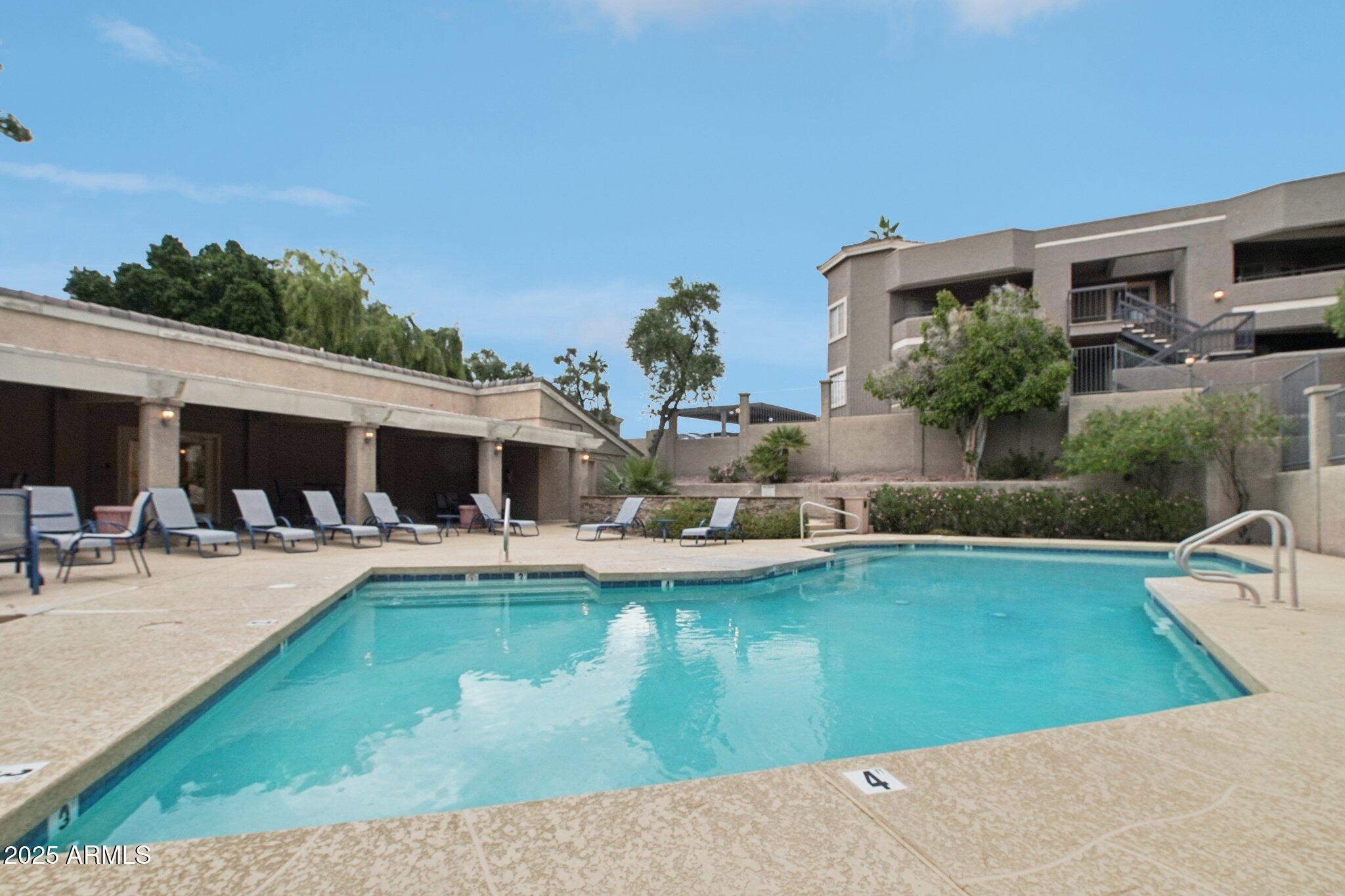 1720 East Thunderbird Road, Unit 2024 Phoenix, AZ 85022 - Photo 19 of 23 a view of a house with swimming pool having outdoor seating