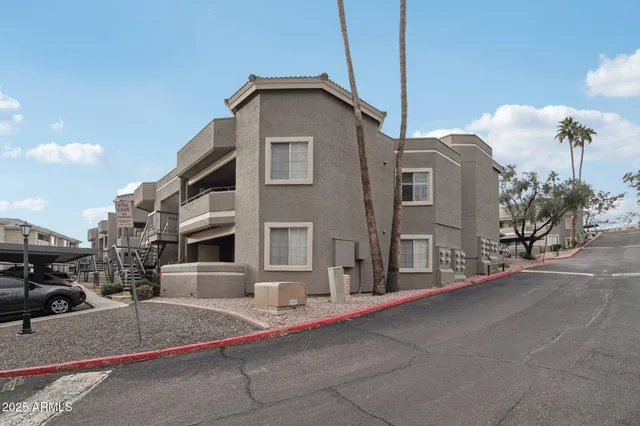 a view of a house with swimming pool having outdoor seating