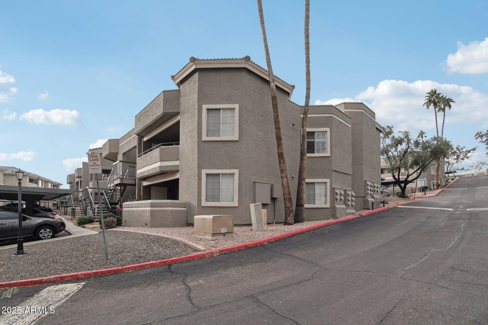 1720 East Thunderbird Road, Unit 2024 Phoenix, AZ 85022 - Photo 20 of 23 a front view of a house with a yard
