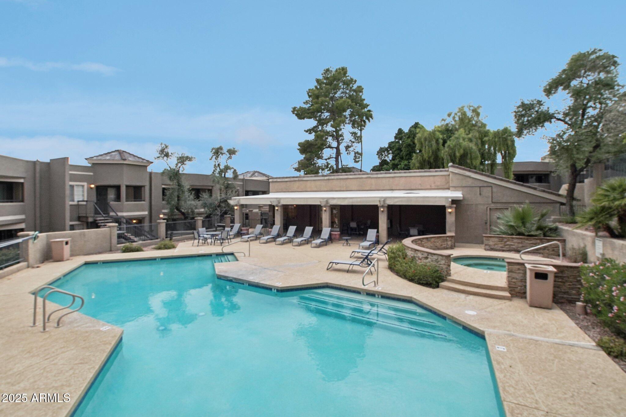 1720 East Thunderbird Road, Unit 2024 Phoenix, AZ 85022 - Photo 21 of 23 a view of a house with swimming pool and sitting area