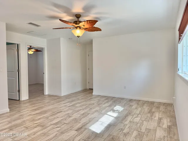 a bathroom with a granite countertop sink mirror vanity and toilet