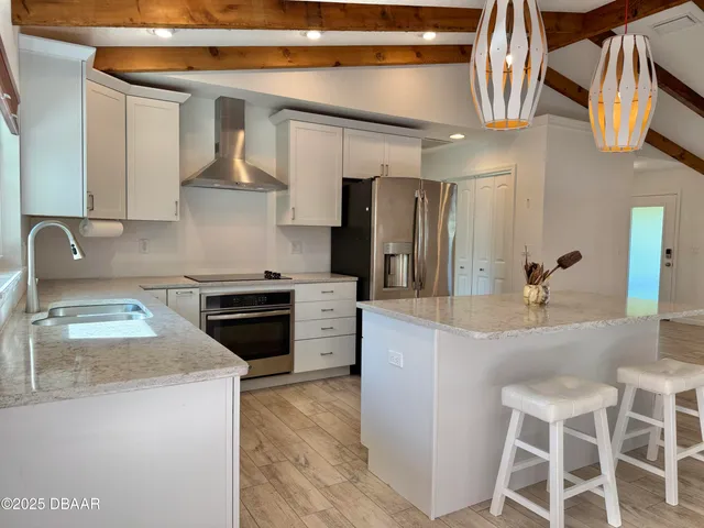 a view of a livingroom with a window and a ceiling fan