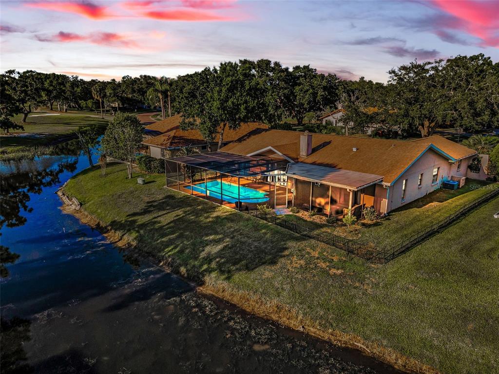 an aerial view of a house with a garden
