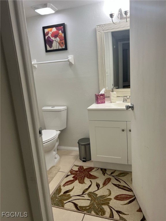 5331 Summerlin Road, Unit 3110 Fort Myers, FL 33919 - Photo 5 of 8 a bathroom with a sink and a mirror