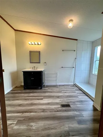 a bathroom with a sink and mirror