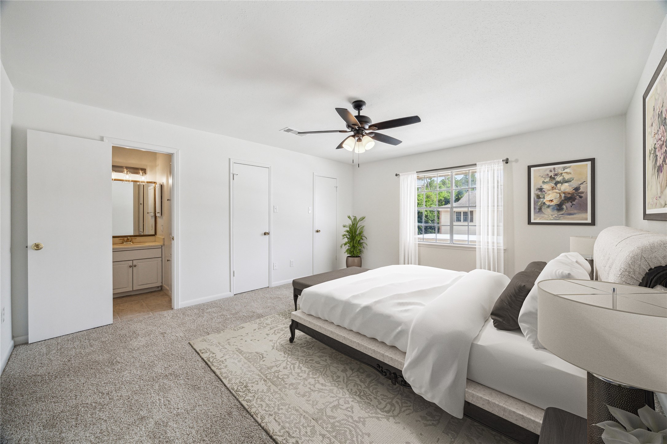 5827 Valley Forge Drive, Unit 83 Houston, TX 77057 - Photo 16 of 25 a bedroom with a large bed and a chandelier