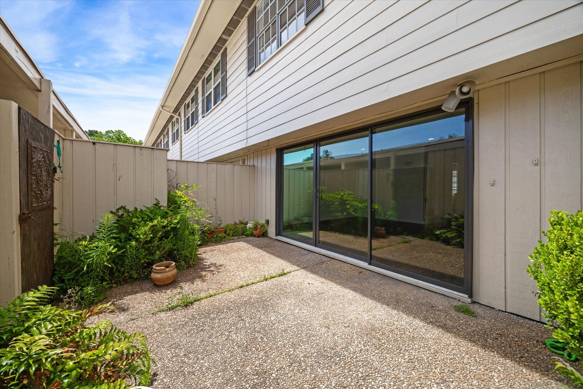 5827 Valley Forge Drive, Unit 83 Houston, TX 77057 - Photo 20 of 25 a view of a backyard with garden