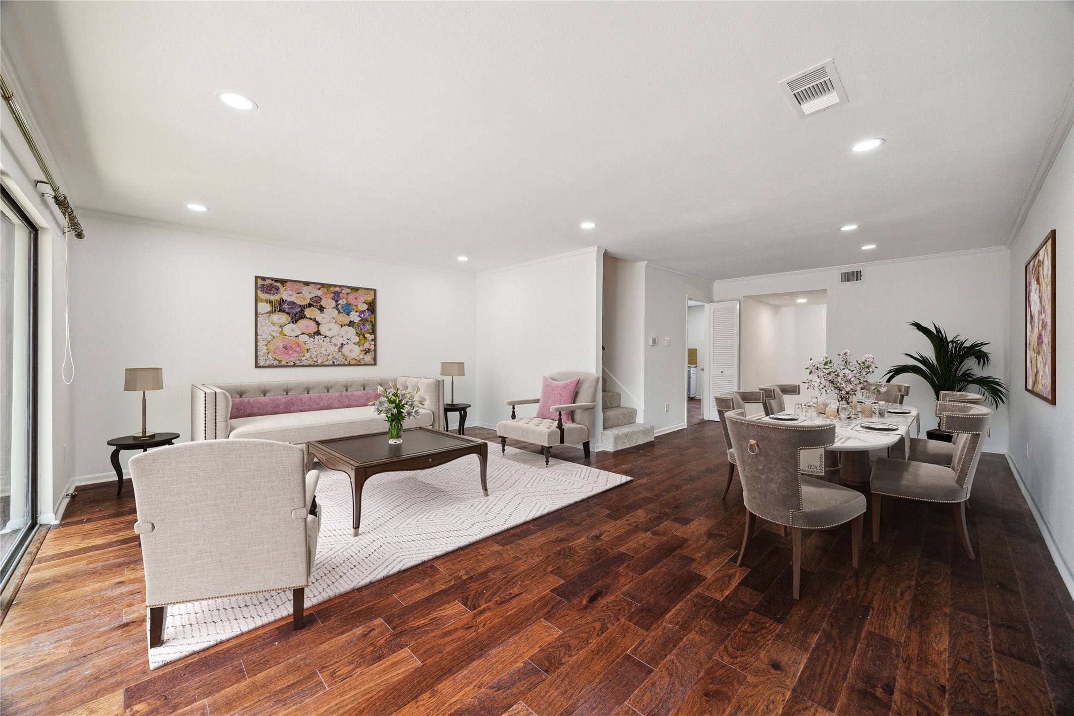 5827 Valley Forge Drive, Unit 83 Houston, TX 77057 - Photo 3 of 25 a living room with furniture a wooden floor and next to a window