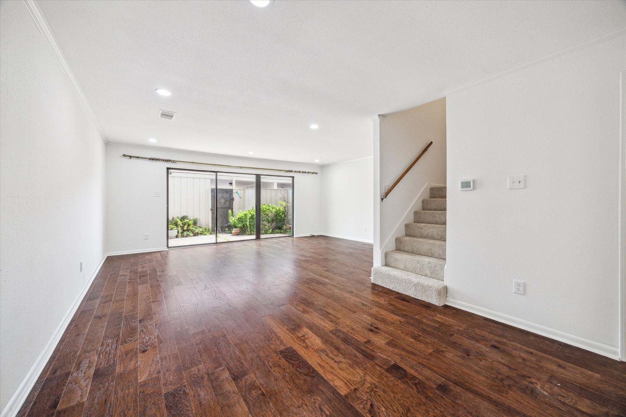 5827 Valley Forge Drive, Unit 83 Houston, TX 77057 - Photo 4 of 25 a view of room with wooden floor and window