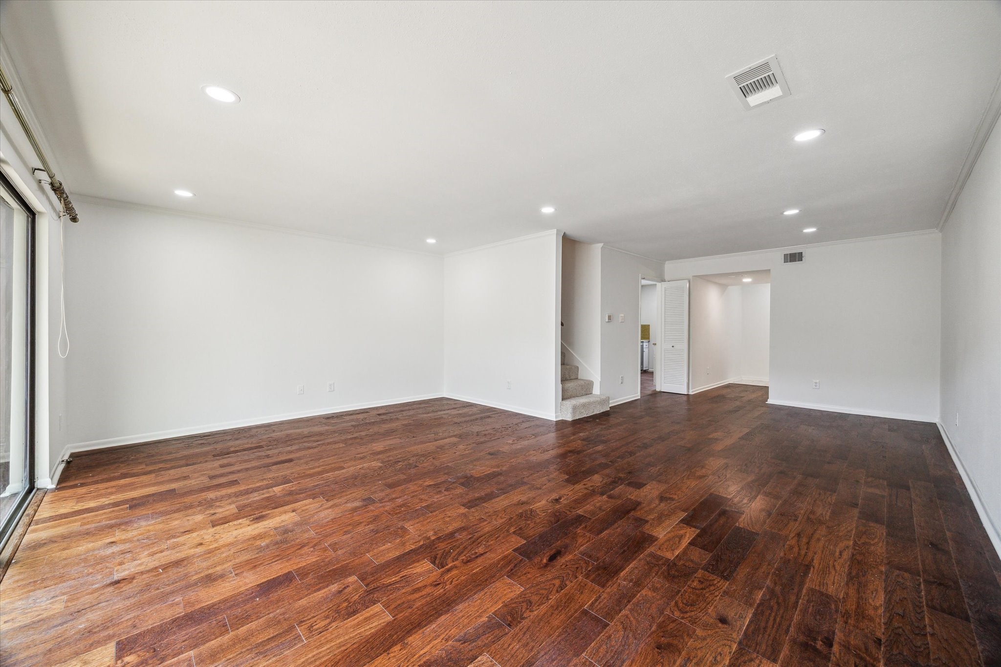 5827 Valley Forge Drive, Unit 83 Houston, TX 77057 - Photo 6 of 25 a view of empty room with wooden floor