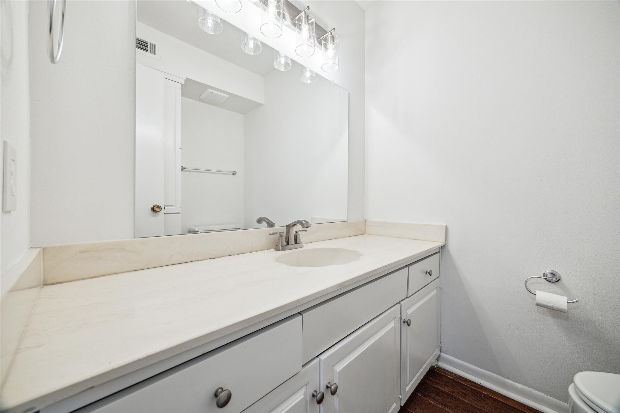 5827 Valley Forge Drive, Unit 83 Houston, TX 77057 - Photo 10 of 25 a bathroom with a sink and a toilet