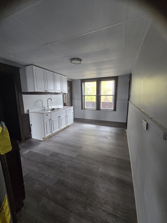 37 Clinton Avenue, Unit 5R Holyoke, MA 01040 - Photo 2 of 9 a big room with wooden floor and windows