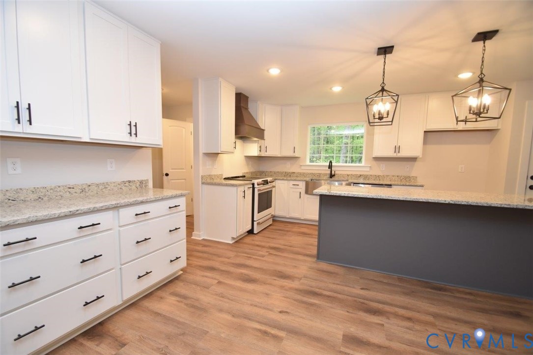 1749 Hollands Road Palmyra, VA 22963 - Photo 8 of 40 Kitchen with hanging light fixtures, white cabinet