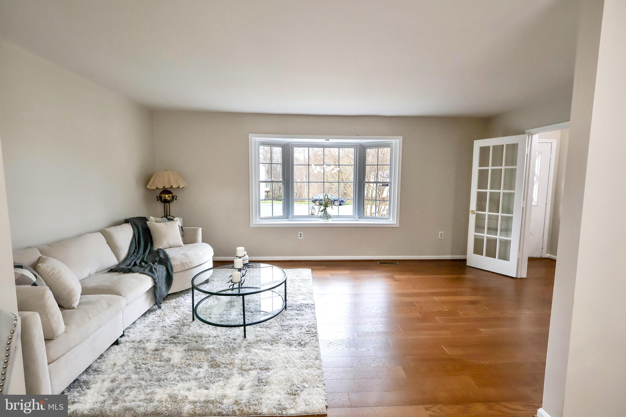 2800 Gunarette Way Silver Spring, MD 20906 - Photo 4 of 48 Living room with large window and french doors.