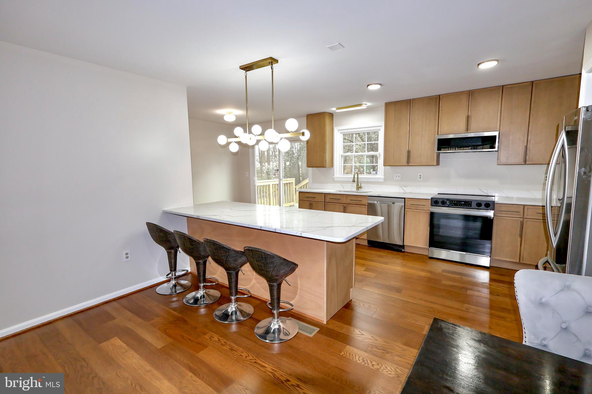 2800 Gunarette Way Silver Spring, MD 20906 - Photo 10 of 48 Large kitchen island well illuminated.