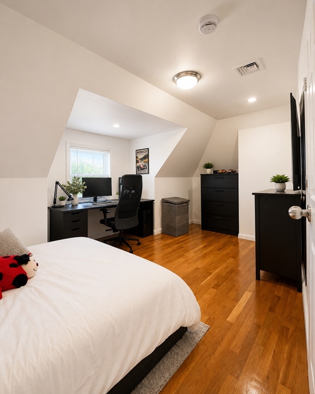 5 Myrtle Street, Unit 3 Saugus, MA 01906 - Photo 4 of 15 a large bedroom with a bed and furniture