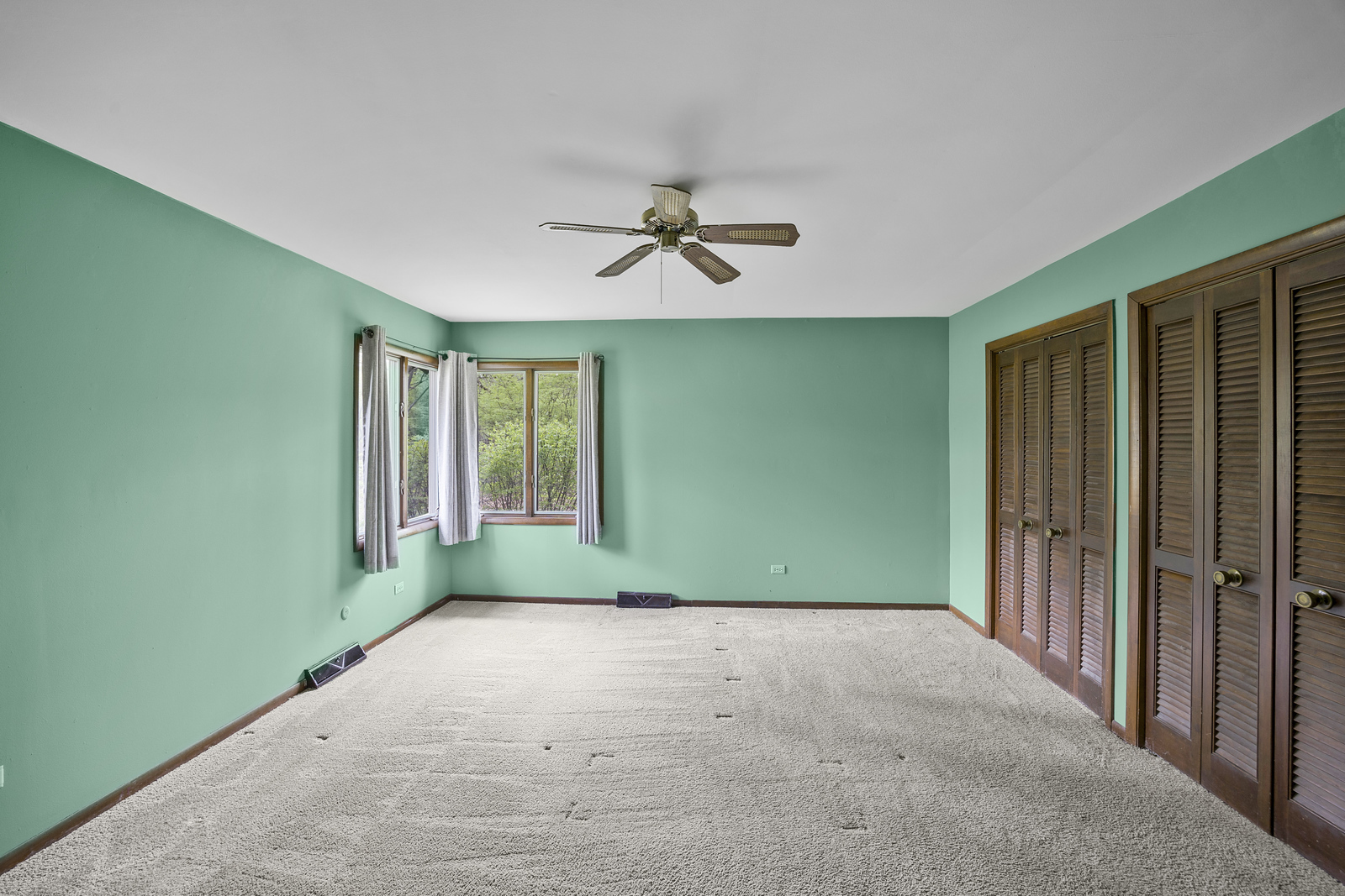 5514 North 13000th Road East Momence, IL 60954 - Photo 11 of 27 an empty room with windows and fan