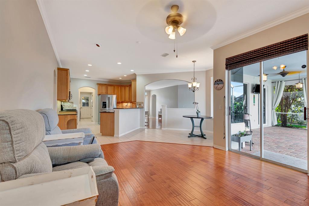 7344 Arrowhead Run Lakewood Ranch, FL 34202 - Photo 11 of 24 a living room with furniture and a wooden floor