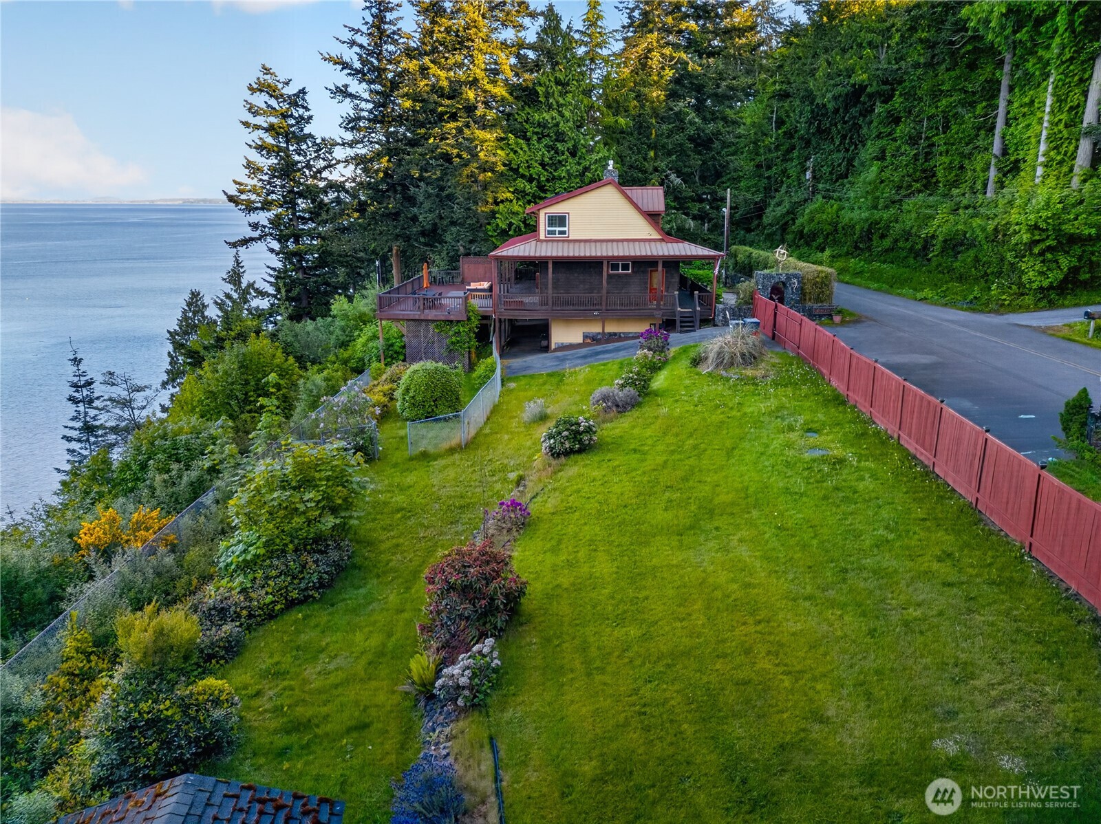 4623 Guemes Island Road Anacortes, WA 98221 - Photo 32 of 40 a table and chairs sitting in the garden