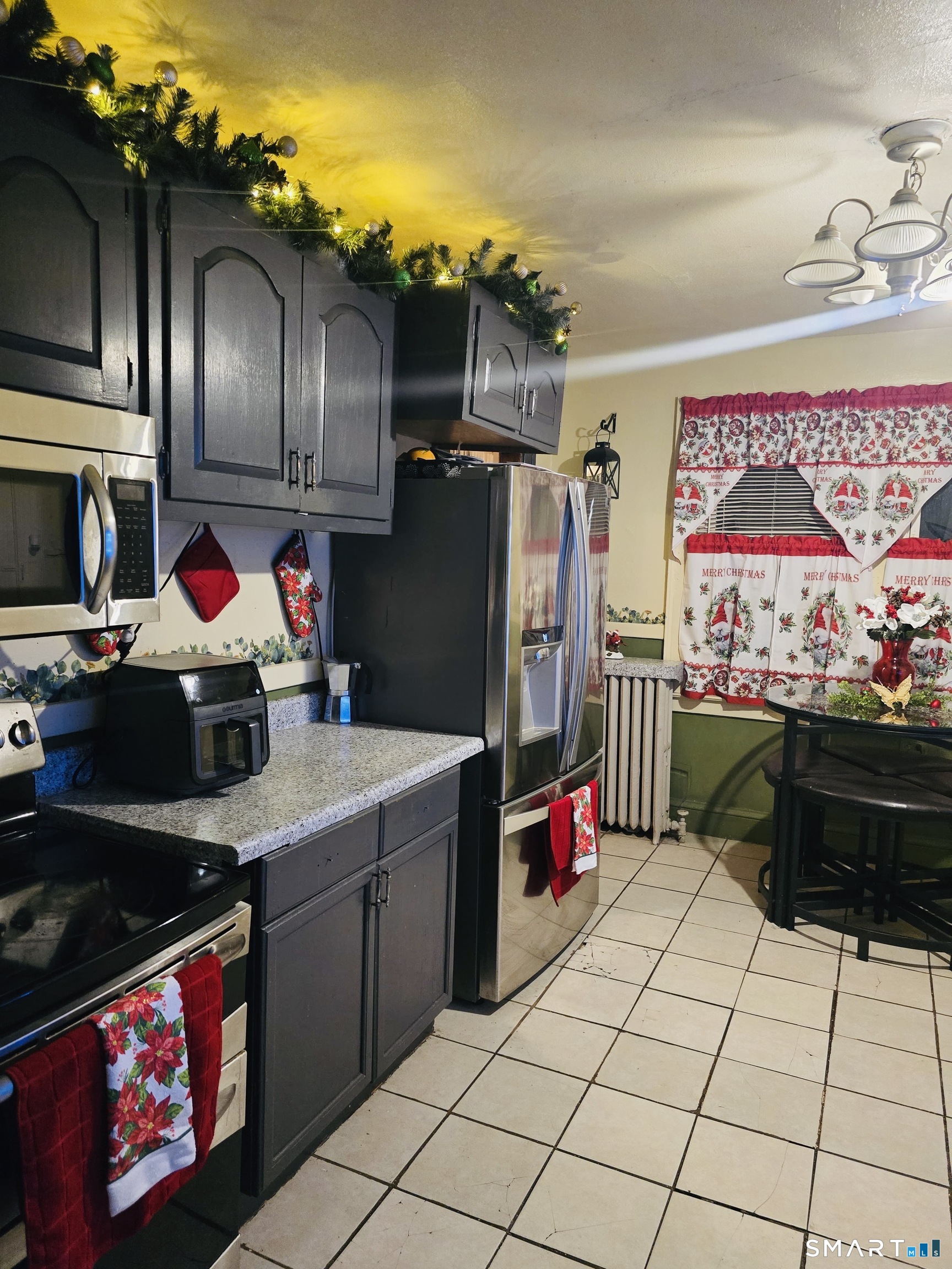 1954 Broad Street Hartford, CT 06114 - Photo 3 of 16 a kitchen with stainless steel appliances granite countertop a sink stove and refrigerator