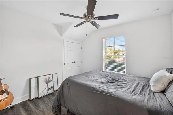 a bedroom with a bed and a window