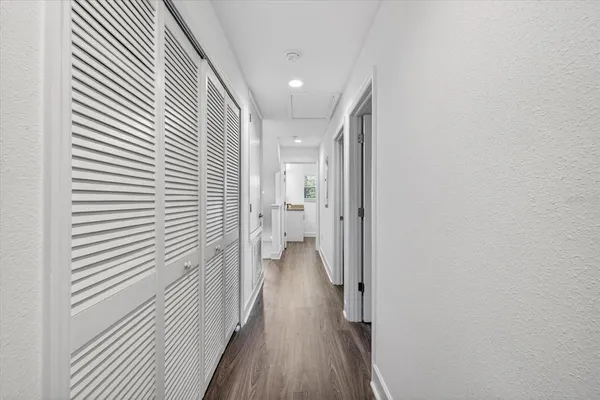 a view of a hallway with a white walls
