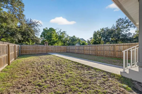 a view of outdoor space with wooden fence