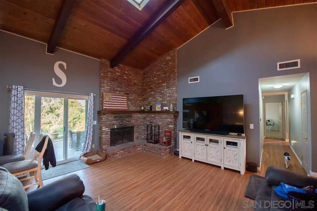 1310 South Grade Road Alpine, CA 91901 - Photo 5 of 18 a living room with furniture and a flat screen tv