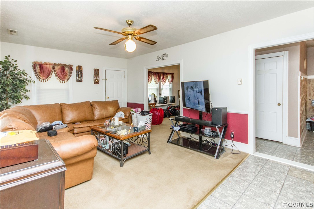 2202 West City Point Road Hopewell, VA 23860 - Photo 5 of 18 a living room with furniture and a ceiling fan
