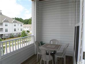 18605 Ruffner Drive, Unit 2B Cornelius, NC 28031 - Photo 11 of 11 a view of a balcony with furniture