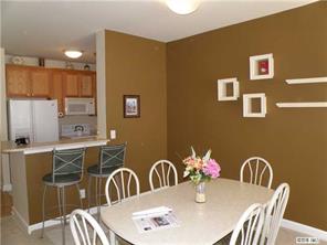 18605 Ruffner Drive, Unit 2B Cornelius, NC 28031 - Photo 3 of 11 a view of a dining room with furniture