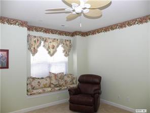 18605 Ruffner Drive, Unit 2B Cornelius, NC 28031 - Photo 6 of 11 a view of a balcony with furniture and a chandelier