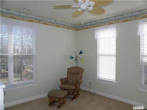 18605 Ruffner Drive, Unit 2B Cornelius, NC 28031 - Photo 8 of 11 a view of a livingroom with furniture and a window