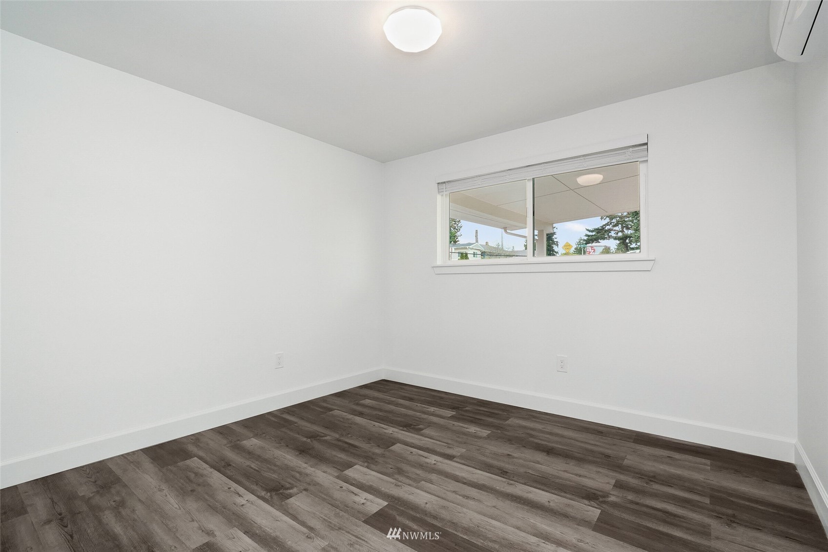 2009 Northeast 24th Street Renton, WA 98056 - Photo 11 of 22 an empty room with wooden floor and window