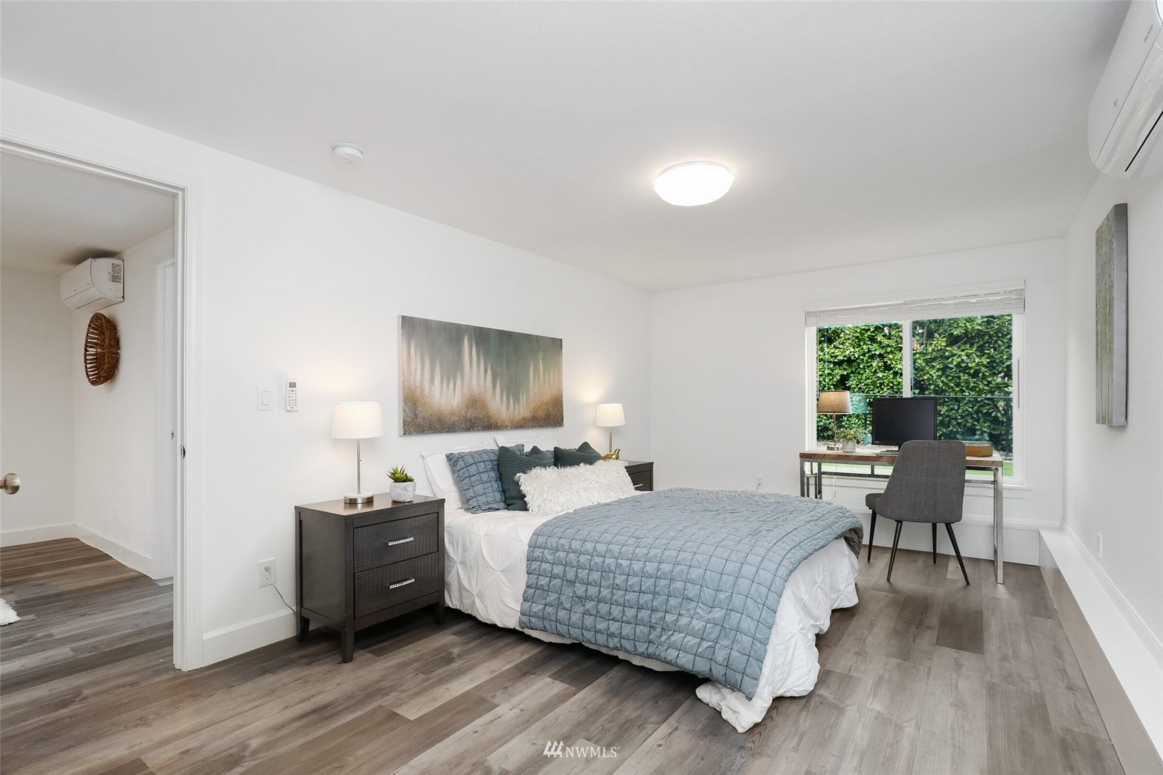 2009 Northeast 24th Street Renton, WA 98056 - Photo 17 of 22 a bedroom with a bed and wooden floor
