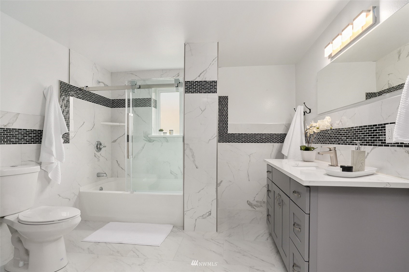 2009 Northeast 24th Street Renton, WA 98056 - Photo 19 of 22 a bathroom with a sink toilet and shower