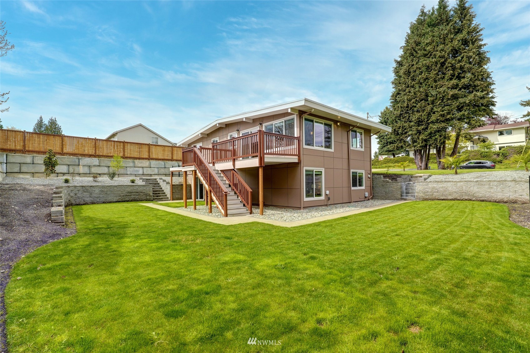 2009 Northeast 24th Street Renton, WA 98056 - Photo 3 of 22 a front view of a house with a yard
