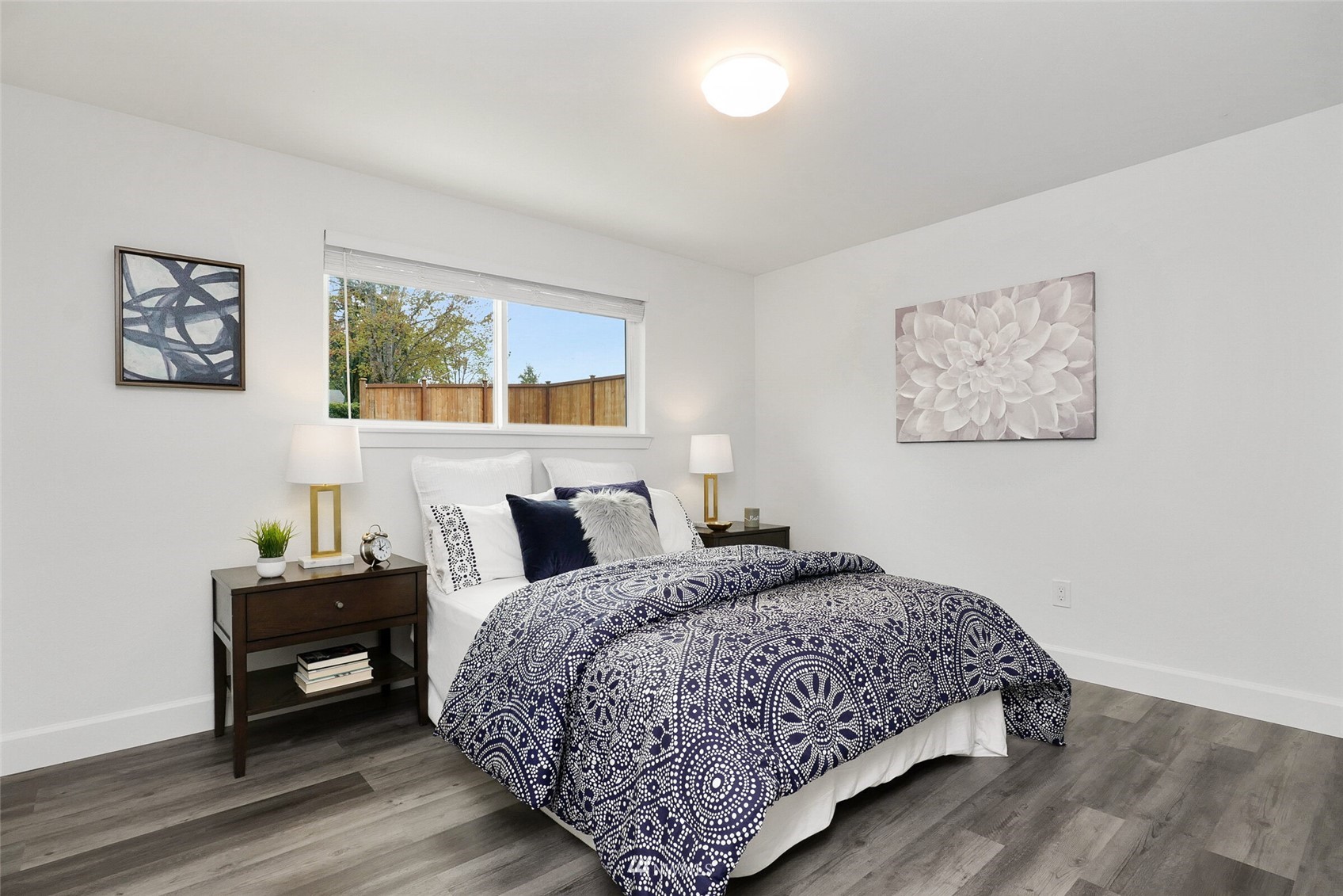 2009 Northeast 24th Street Renton, WA 98056 - Photo 9 of 22 a bedroom with a bed and a window