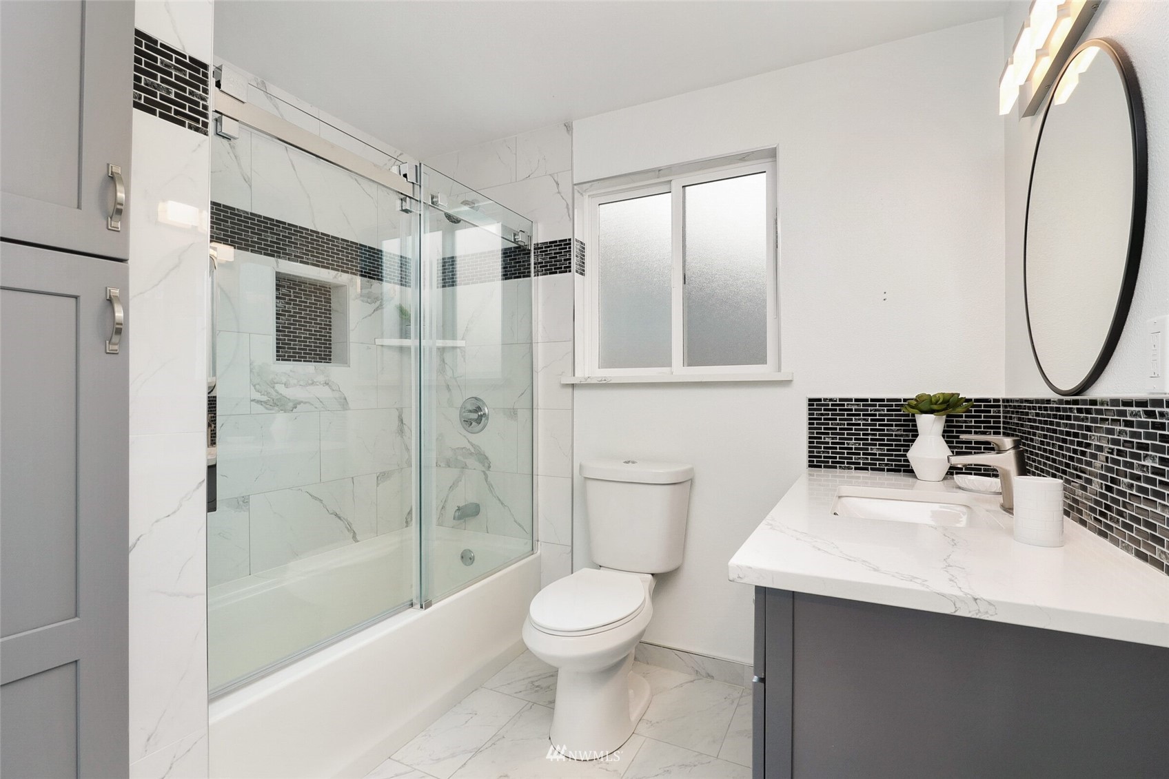 2009 Northeast 24th Street Renton, WA 98056 - Photo 10 of 22 a bathroom with a sink toilet and shower