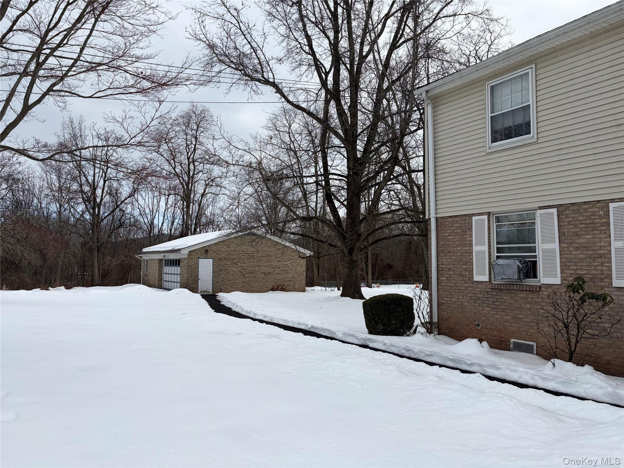 83 Gilchrest Road Valley Cottage, NY 10989 - Photo 5 of 5 a view of backyard with barbeque oven and trees