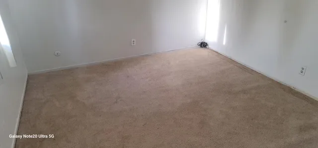 a view of cars parked in front of a building