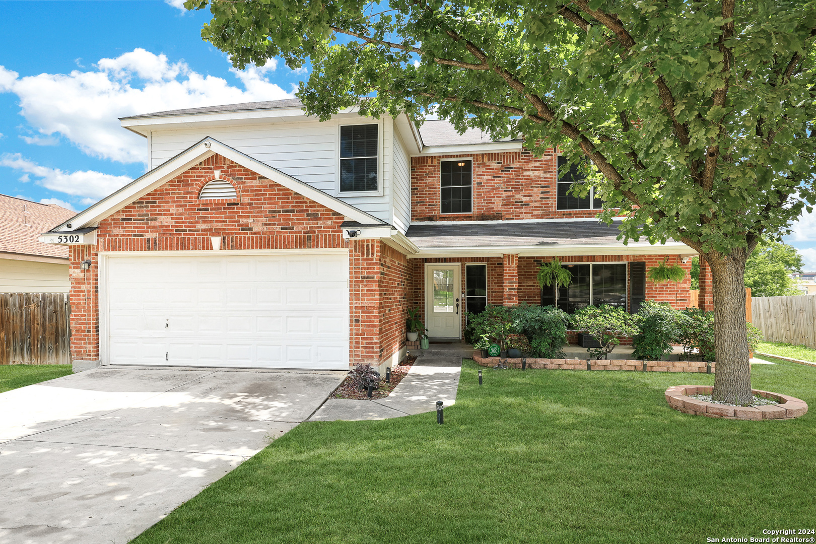 5302 Lost Tree San Antonio, TX 78244 - Photo 1 of 1 a front view of a house with a yard and garage