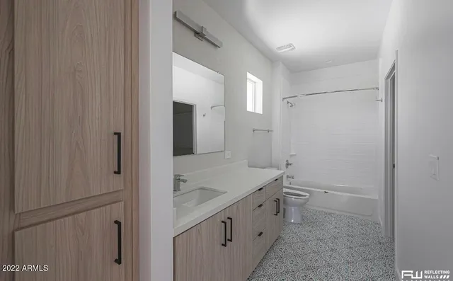 a bathroom with a granite countertop sink and mirror