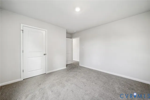 a view of an empty room and entryway