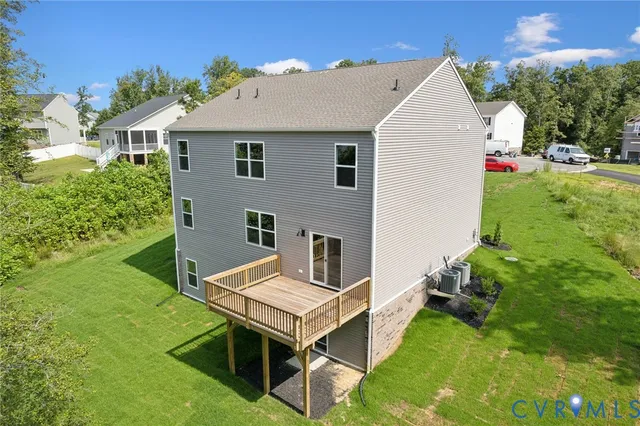 a aerial view of a house with yard and sitting area