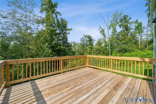 a view of balcony with wooden floor and fence