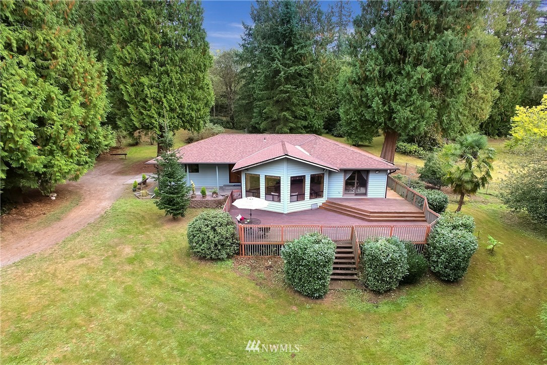 20109 Southeast 142nd Street Renton, WA 98059 - Photo 1 of 39 a front view of a house with garden